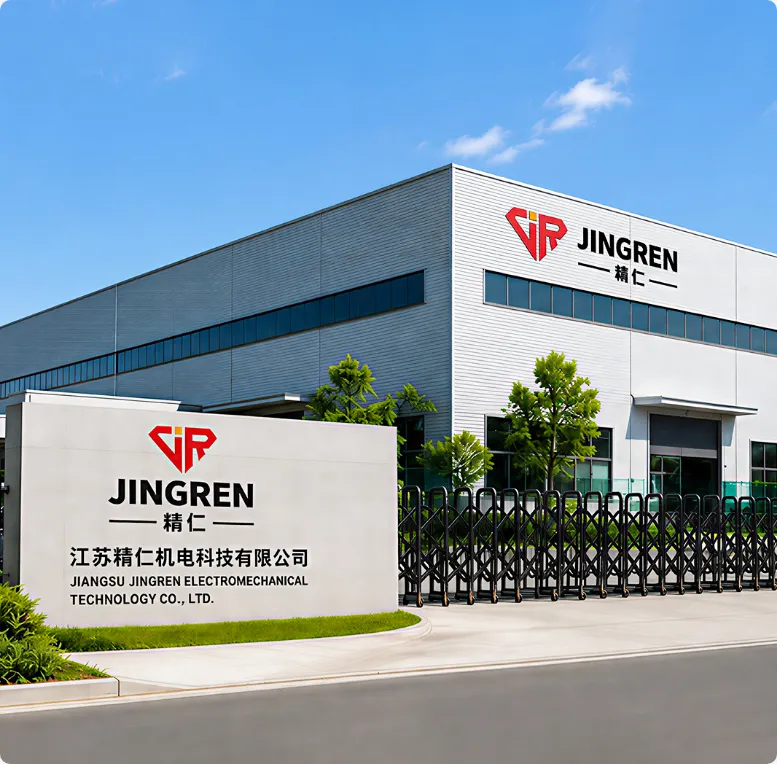 A modern industrial building with the 'JINGREN' logo prominently displayed, surrounded by green landscaping and a gated 