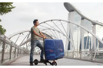 Electric scooter folds to become a hand trolley